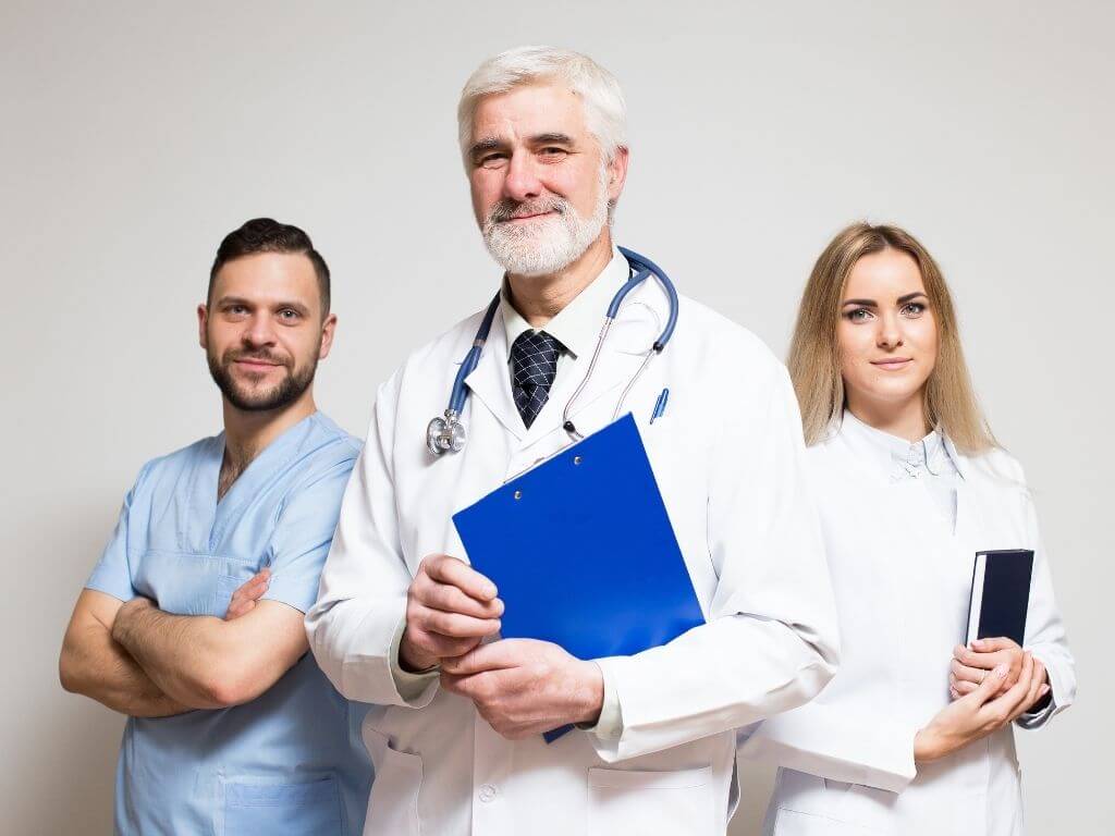 About Us page image - Doctor standing with medical billers1